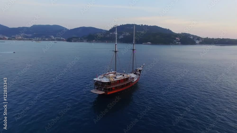 Aerial Video. The drone revolves around a sailboat at sea
Sunset. Aerial Video. The drone revolves around a sailboat at sea
Sunset.
