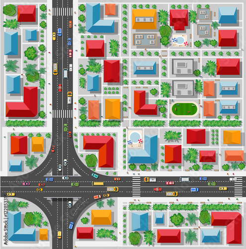 Top view of a highway junction and a traffic intersection in the city with houses, trees and streets