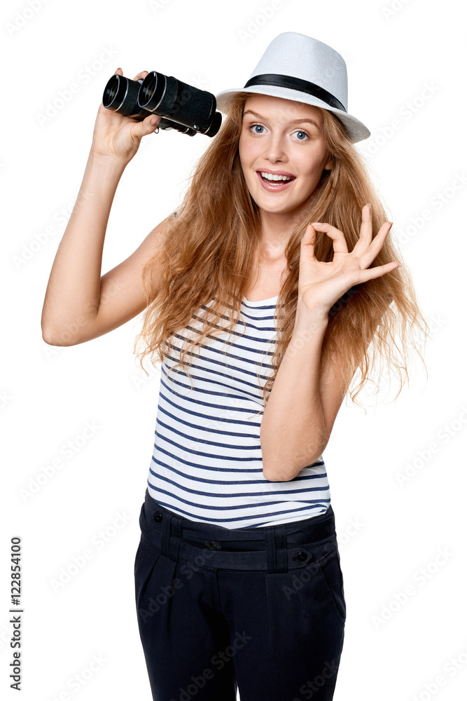 Female with binoculars gesturing OK Female with binoculars gesturing OK