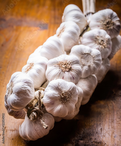 Garlic. Bunch of fresh garlic with celery herbs.