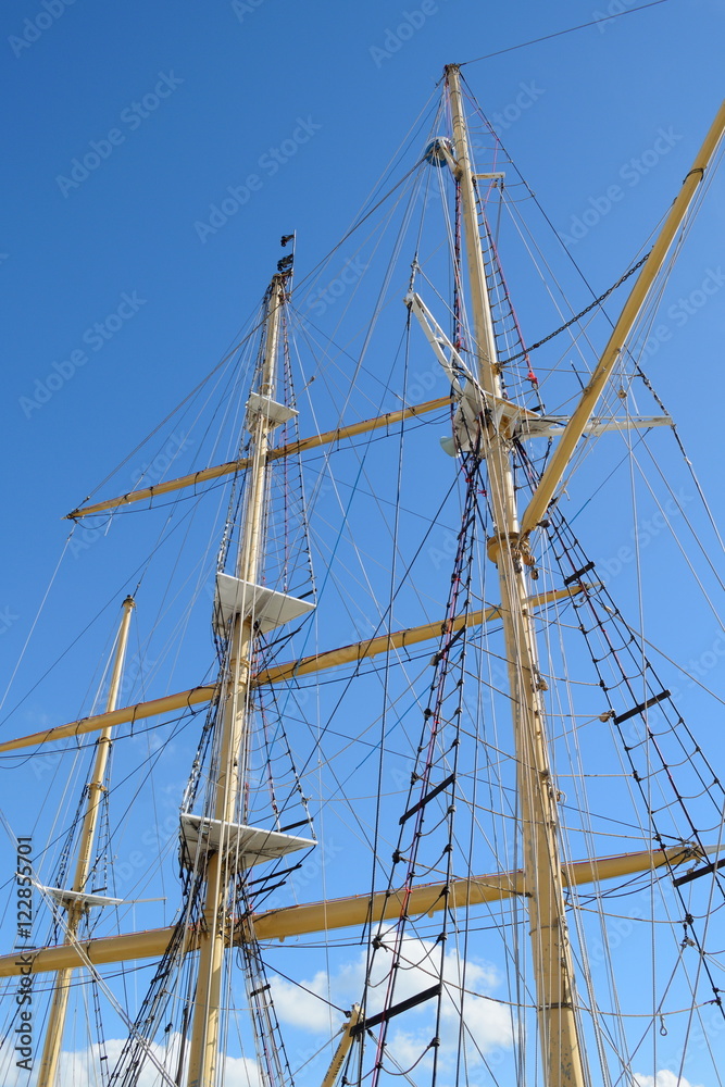 Rigging of a large sailing vessel against blue sky Rigging of a large sailing vessel against blue sky