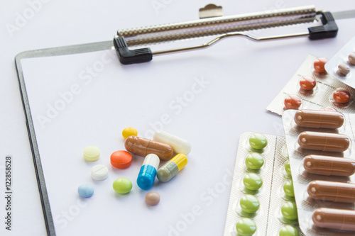 clipboard with colored pills