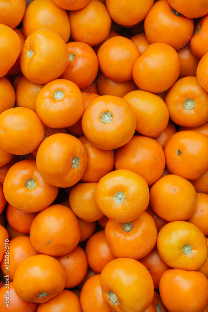 Pile of orange tomatoes