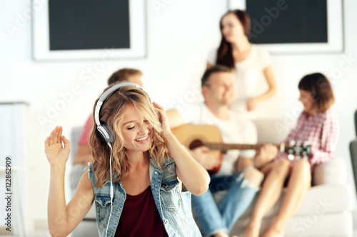 Beautiful girl listening to...