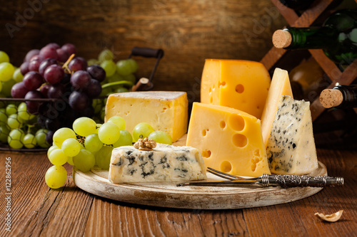 Canvas Print Mix cheese on wooden board.