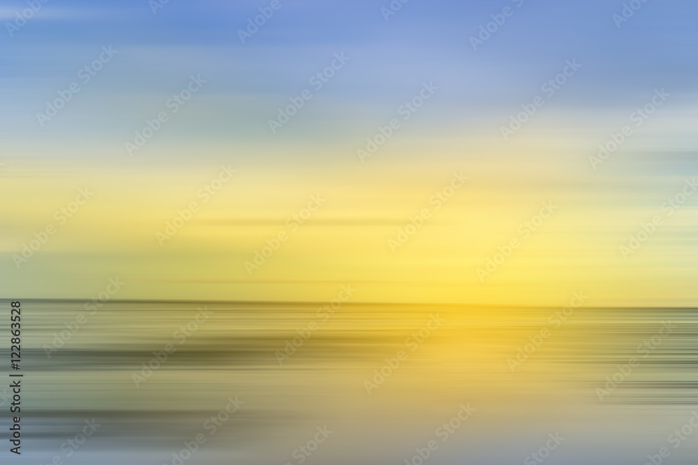 abstract scene of motion blur sea with sun light yellow