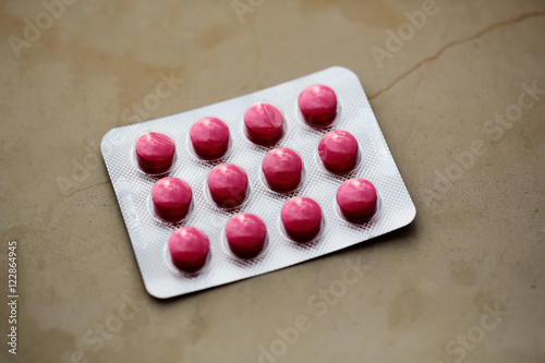 Red tablets in blister pack