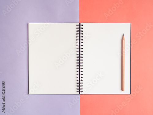 Top view of notebook on colorful background
