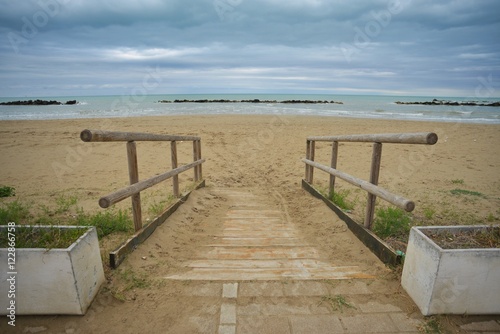 wooden walkway on the sand