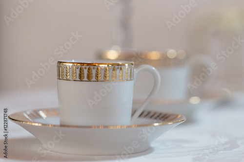 Fotografie Demitasse with golden design sparkles in the light
