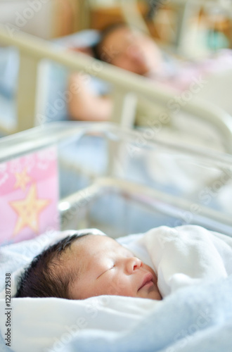 Asian mother with newborn baby in the hospital