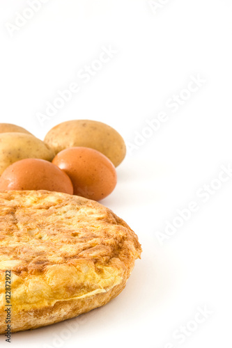 Traditional spanish omelette with potatoes and eggs isolated on white background