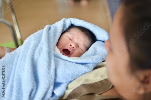 Asian mother with newborn baby in the hospital