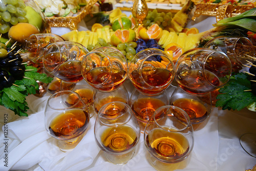 Glasses of cognac on dessert table