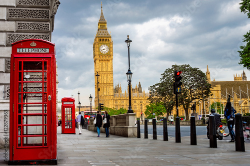 Big Ben on a Cloudy Spring Day with Traditional Red Phone Booths in Foreground