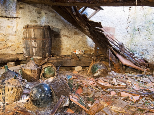 Bild auf Leinwand Dereliction, tumbledown abandoned property, cellar with demijohns