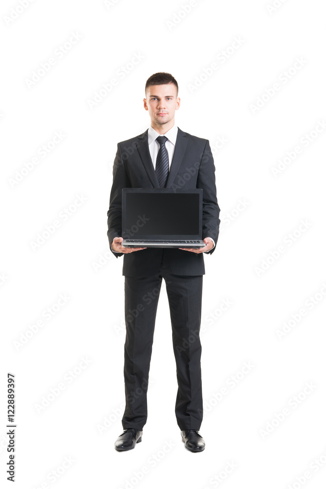 Young and confident business man holding a laptop Young and confident business man holding a laptop