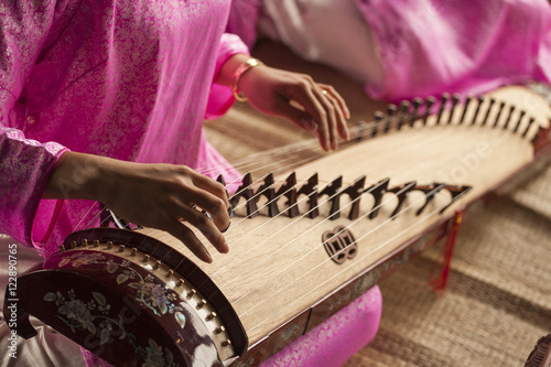 Canvastavla Woman play a traditional korean string instrument : the gayageum