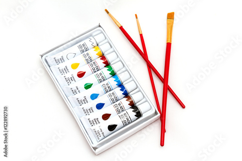 set of paints and brushes for painting isolated on white background