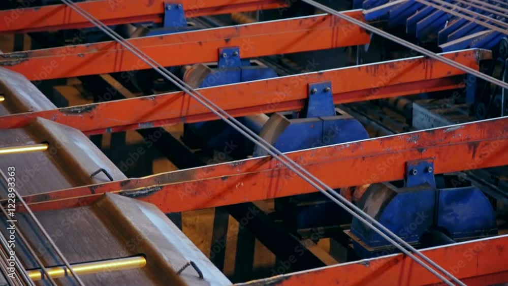 Ironworks plant. Moving fittings over guides. Closeup