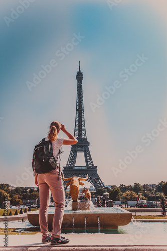 young woman shares the enthusiasm of the visits Eiffel tower in