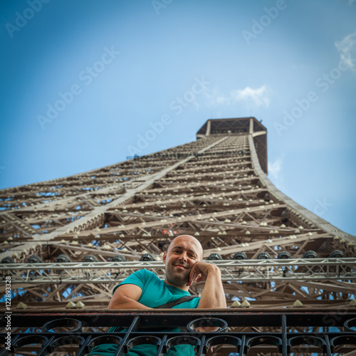 young man shares the enthusiasm of the visits Eiffel tower in Pa