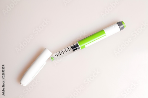 Composition with insulin pen. World Diabetes Day.