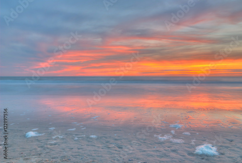 Sunset on a beach at the North Sea. The photo was taken in Noordwijk  the Netherlands