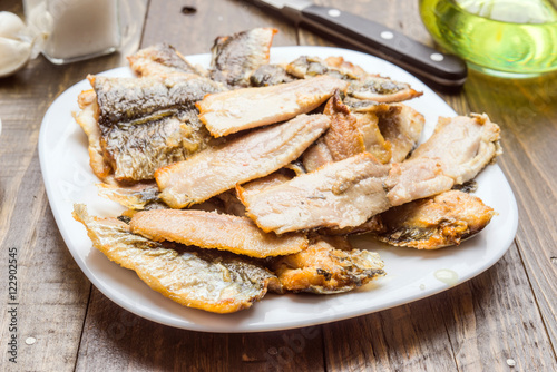 sardine fillets fried in white dish