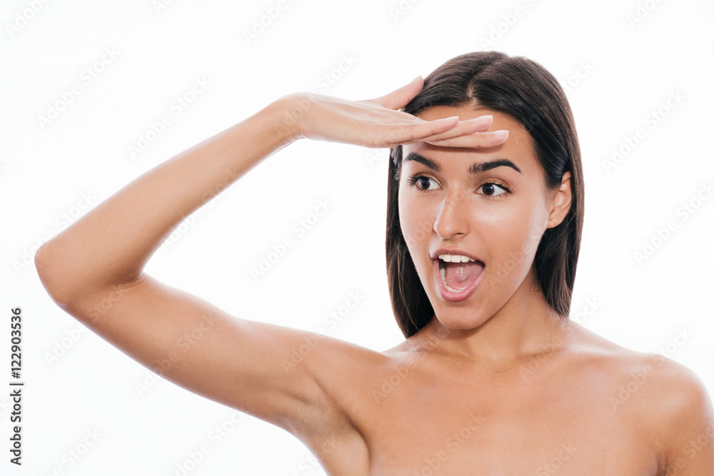 Portrait of beautiful surprised woman with hand on forehead with clear skin, on white background Portrait of beautiful surprised woman with hand on forehead with clear skin, on white background