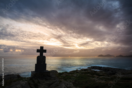 Stone cross monuments by the sea in the sunrise, Castro Urdiales, Cantabria