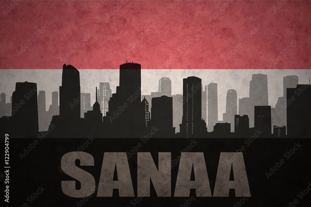 abstract silhouette of the city with text Sanaa at the vintage yemen flag background