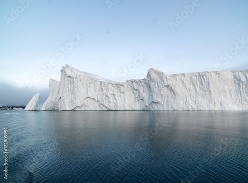 Big icebergs are ont he arctic ocean in Greenland