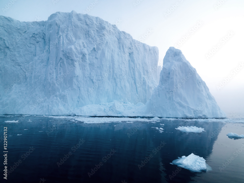 Big icebergs are ont he arctic ocean in Greenland Big icebergs are ont he arctic ocean in Greenland