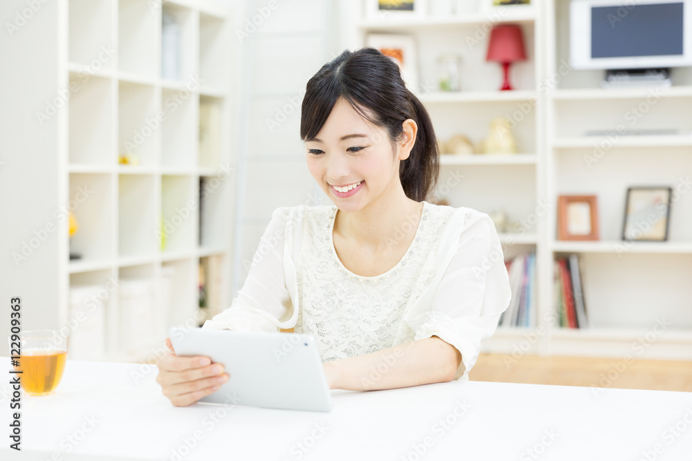 portrait of young asian woman using tablet computer portrait of young asian woman using tablet computer