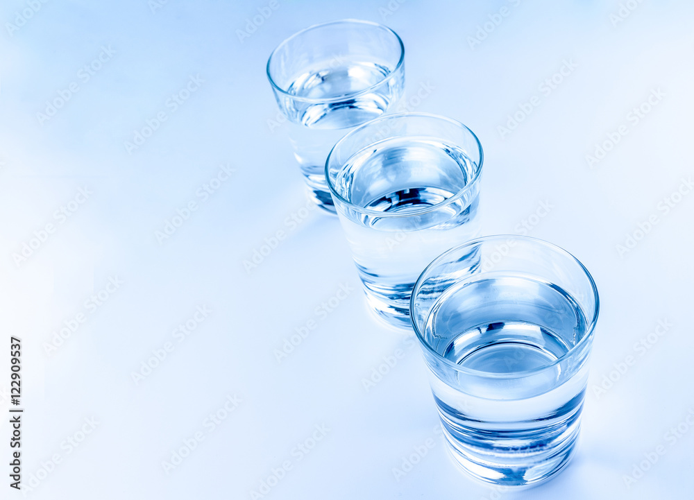 top of view of three drink glasses with water, nutrition and health-care concept top of view of three drink glasses with water, nutrition and health-care concept