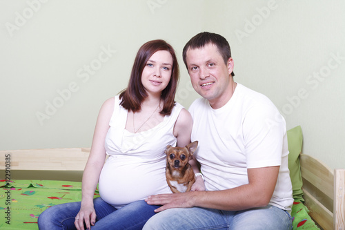 Pregnant happy young parents waiting for baby s birth