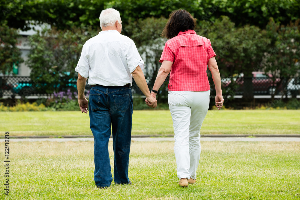 Couple Walking In Park