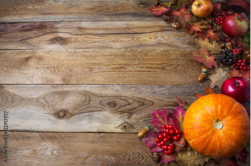 Thanksgiving or fall greeting background with pumpkins and fall