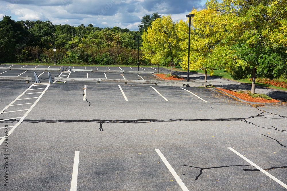 Obraz premium autumn colorful trees in parking lot of residential apartment