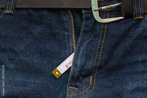 jeans open zip with measuring tape, small penis size concept photo