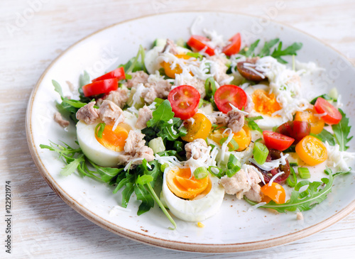 Fresh salad with fish, eggs and tomatoes.