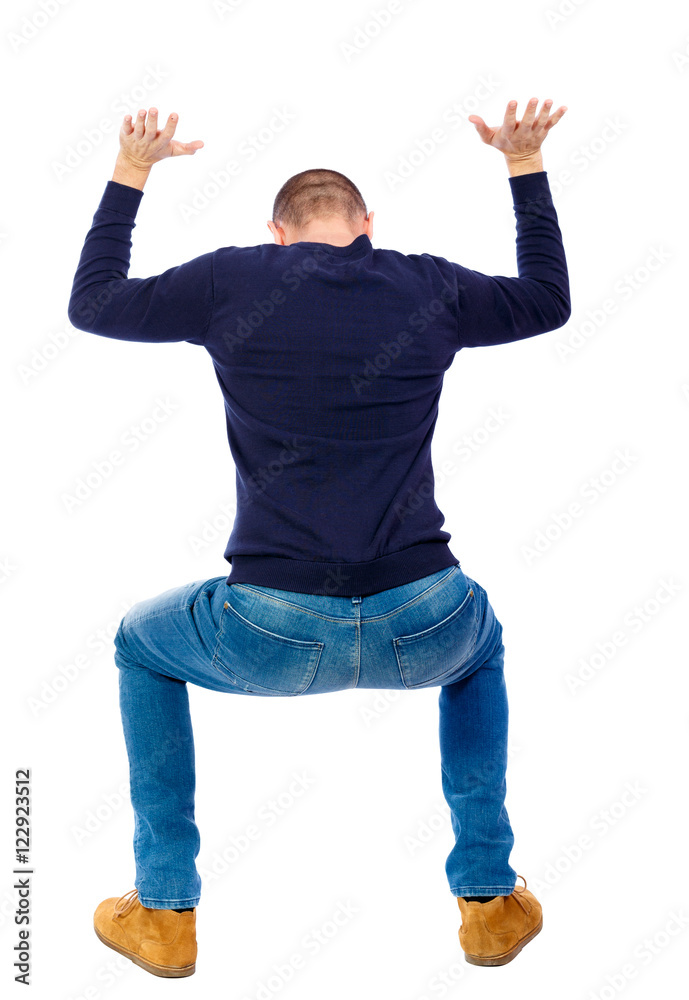 back view. man protects hands from what is falling from above. Man holding a heavy load Rear view people collection. backside view of person. Isolated over white background. A guy in a black back view. man protects hands from what is falling from above. Man holding a heavy load Rear view people collection. backside view of person. Isolated over white background. A guy in a black
