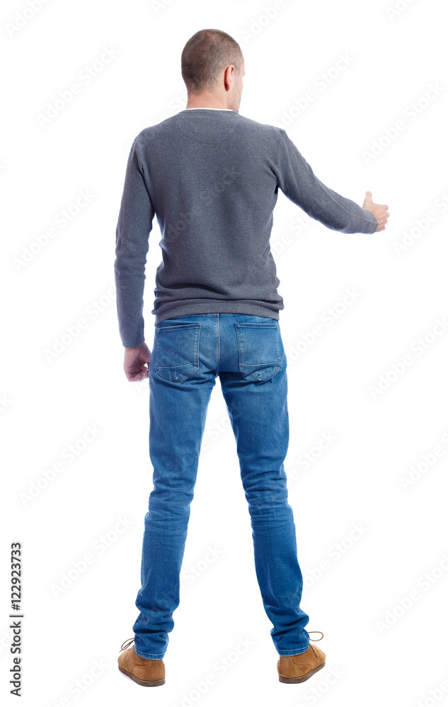 Back side view of man in shirt handshake. Rear view people collection. backside view of person. Isolated over white background. A guy in a gray sweater holds out his hand in greeting. Back side view of man in shirt handshake. Rear view people collection. backside view of person. Isolated over white background. A guy in a gray sweater holds out his hand in greeting.