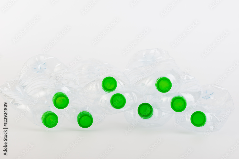 Recyclable garbage of plastic bottles on white background