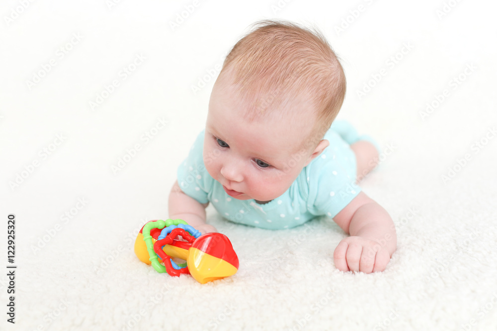 2 months cute baby girl with rattle 2 months cute baby girl with rattle