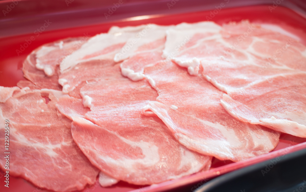Raw sliced pork preparing for homemade sukiyaki Raw sliced pork preparing for homemade sukiyaki