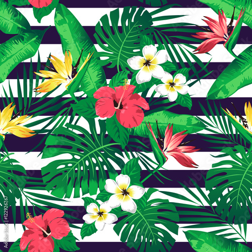 Tropical flowers and leaves on striped background. Seamless. Vector. © Angelina Bambina