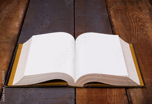 Open Bible on wooden boards
