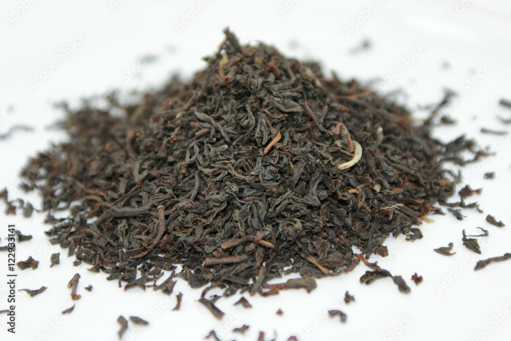 Dry black tea leaves isolated on white background. Dry black tea leaves isolated on white background.
